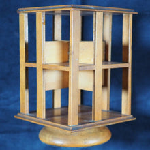 Load image into Gallery viewer, Revolving Bookcase. Slim, revolving, sycamore bookcase for miniature books. 1904.