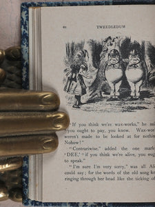 Carroll, Lewis. Alice in Wonderland [with] Alice through the Looking-Glass and what Alice found there. Wood, Edmund S. Paris. 1950.