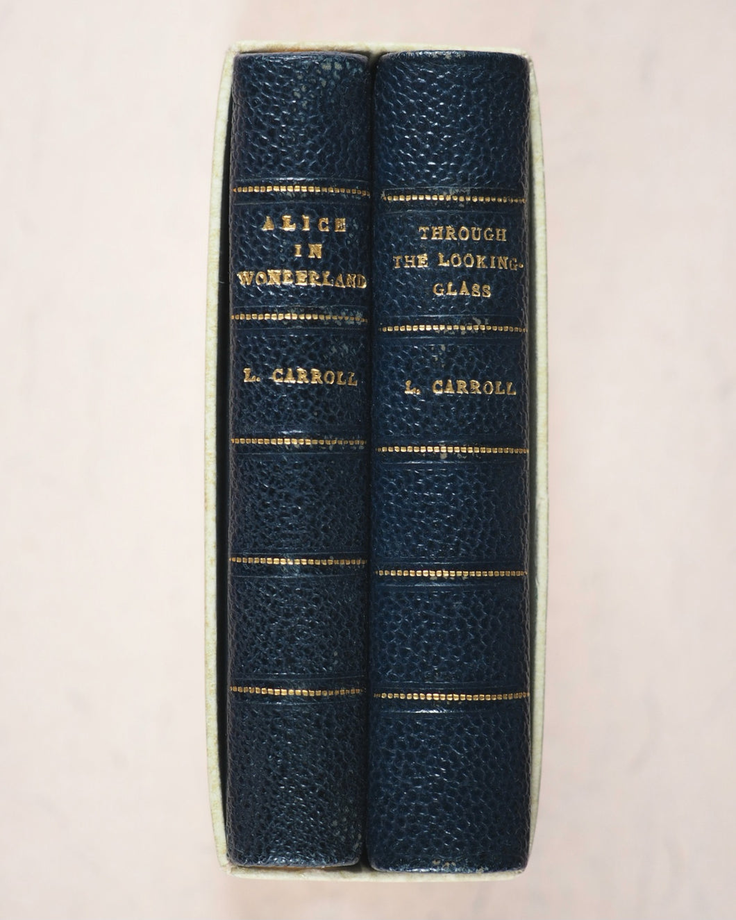 Carroll, Lewis. Alice in Wonderland [with] Alice through the Looking-Glass and what Alice found there. Wood, Edmund S. Paris. 1950.