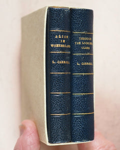 Carroll, Lewis. Alice in Wonderland [with] Alice through the Looking-Glass and what Alice found there. Wood, Edmund S. Paris. 1950.