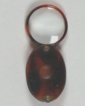 Load image into Gallery viewer, Miniature magnifying glass. [no maker, no date, no place of manufacture, circa 1910].
