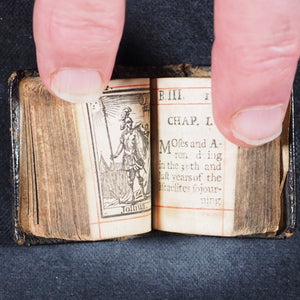 Biblia or a Practical Summary of Old & New Testaments. 1728. Wilkin, R. [London]. 1727. Underlined in red and hand corrected to 1728. Black binding.