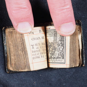 Biblia or a Practical Summary of Old & New Testaments. 1728. Wilkin, R. [London]. 1727. Underlined in red and hand corrected to 1728. Black binding.